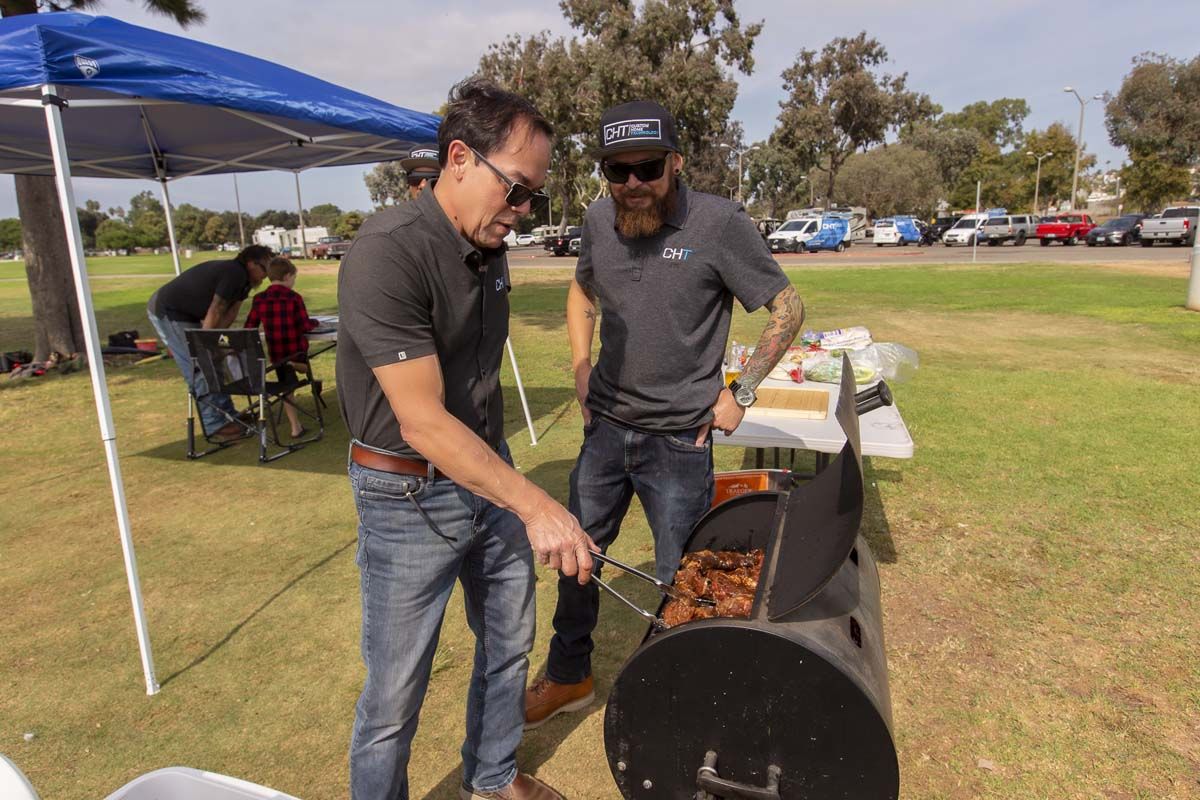 Two men in park grilling